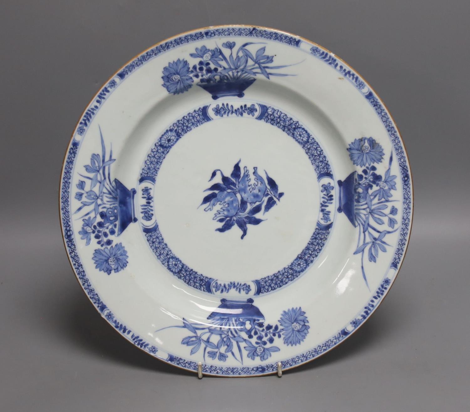 An 18th century Chinese blue and white circular dish decorated with flowering plants,Dia 32.5cm
