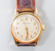 A lady's 14k Tiffany & Co manual wind wrist watch, on associated leather strap, case diameter