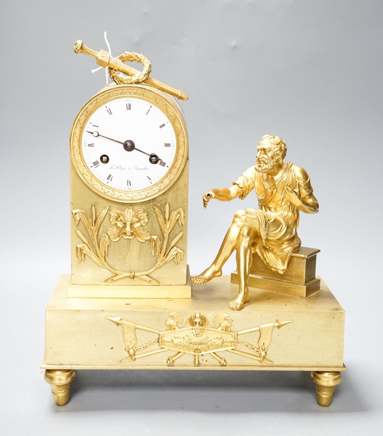 An early 19th century French ormolu mantel clock, silk suspension and outside countwheel, 32cm