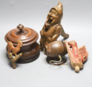 A Lignum Vitae barrel-shaped string holder on circular base, a Dutch turned wood tobacco jar and