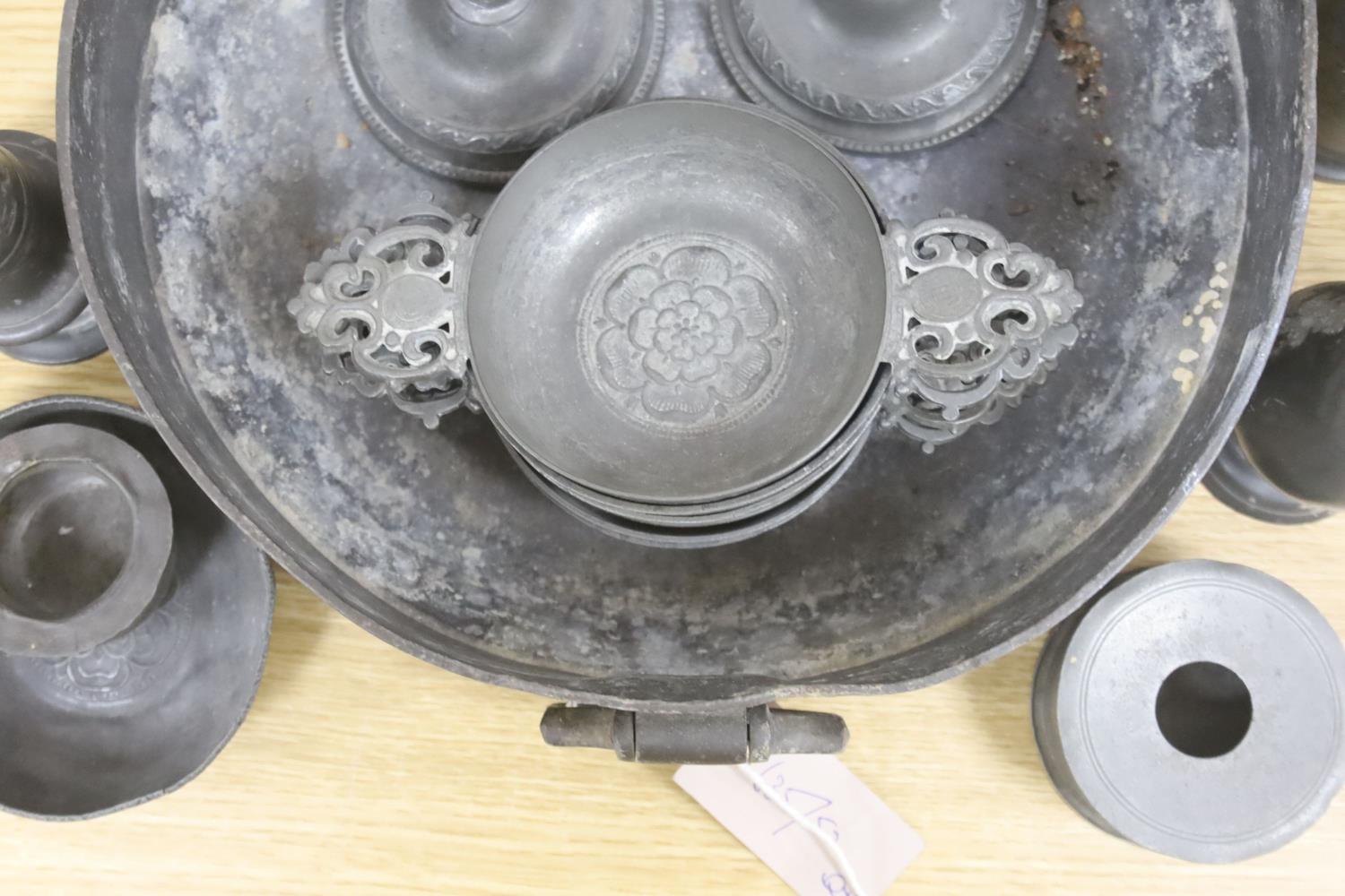 A collection of Dutch antique pewter, including two-handled bowl, wine taster, measures, etc. - Image 3 of 4