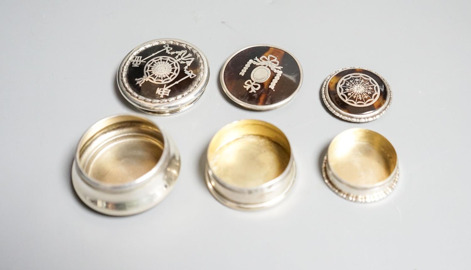 Three assorted early 20th century small silver and tortoiseshell pique circular boxes and covers, - Image 3 of 3