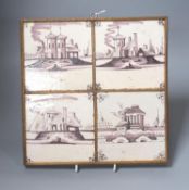 A set of four 18th century Dutch Delft manganese tiles decorated with buildings by a canal (frame