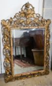 A Victorian carved giltwood and gesso rectangular wall mirror with pierced fruiting vine border,