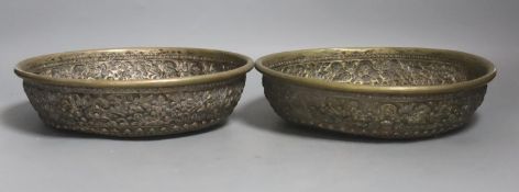 A pair of Far Eastern embossed silvered metal circular bowls,Dia 22.5cm