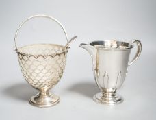 A modern silver sugar basket and sifter spoons, with glass liner by Mappin & Webb, 9.8cm and an