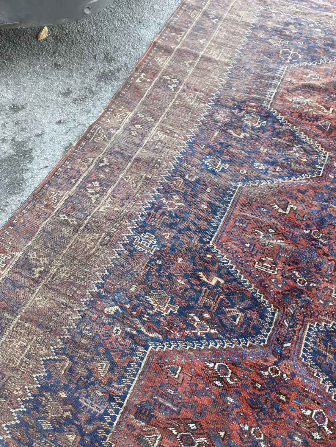 An antique Shirvan red ground carpet (worn), 295 x 207cm - Image 4 of 7