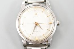 A gentleman's late 1950's stainless steel Omega Seamaster automatic wrist watch, on associated steel