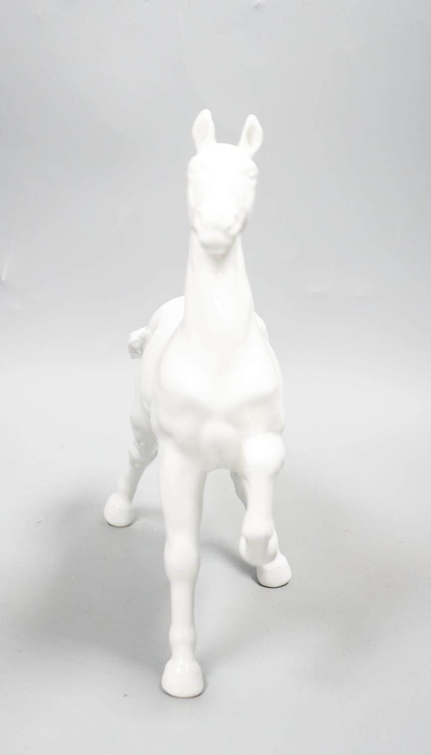 A Japanese porcelain figure of a horse, a Chinese blue and white dish, a Southeast Asian metal - Image 2 of 7