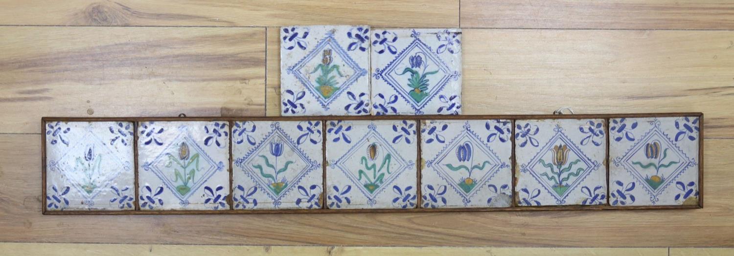 Seven 17th century Dutch Delft tiles, polychrome-decorated with tulips and having fleur-de-lys