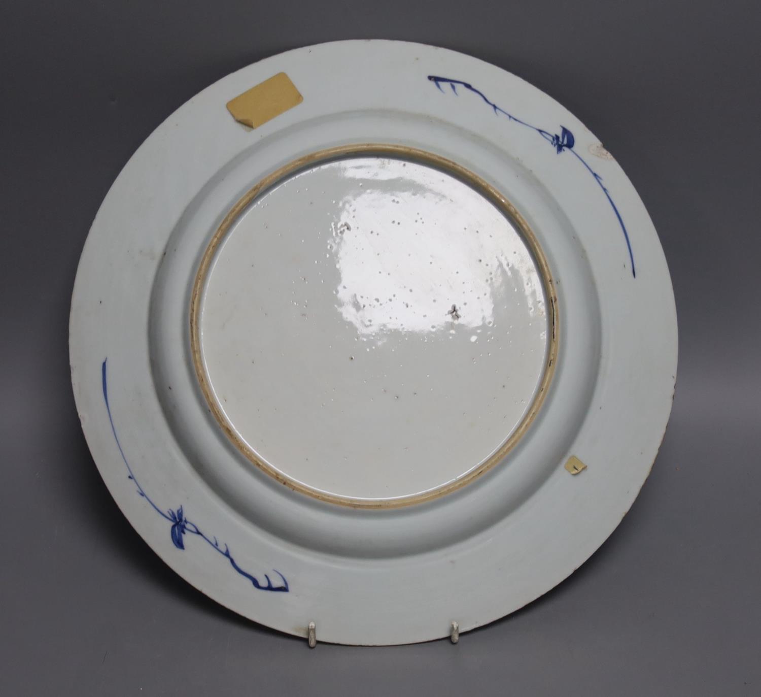An 18th century Chinese blue and white circular dish decorated with flowering plants,Dia 32.5cm - Image 2 of 2