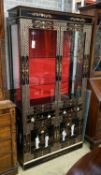 A Chinese style chinoiserie lacquer display cabinet with faux hardstone decoration, width 95cm,