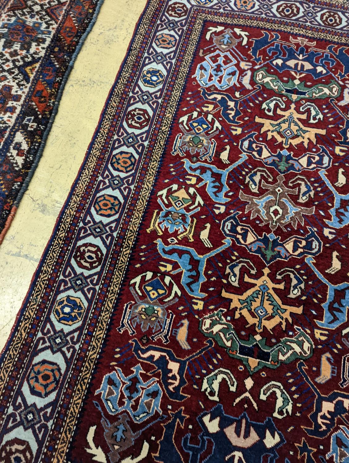 A Caucasian design burgundy ground rug, 153 x 100cm - Image 3 of 4