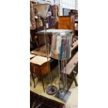 A mid century design perspex column uplighter floor lamp together with a chrome floor lamp, larger