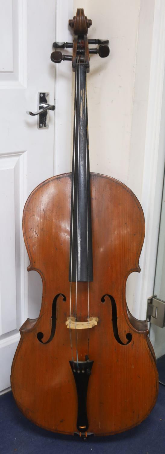 Early 20th century German cello and bow, the back measuring 75cm excluding the button
