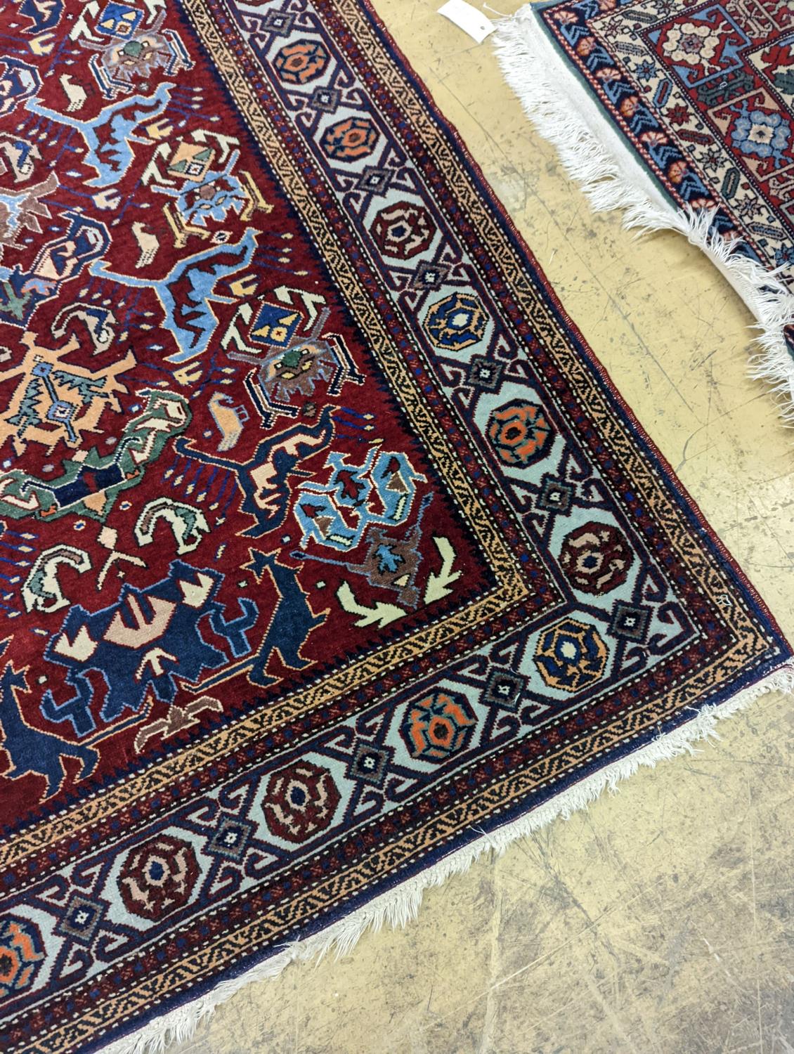 A Caucasian design burgundy ground rug, 153 x 100cm - Image 2 of 4