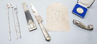 A silver plaque, two mate straws, knife etc.