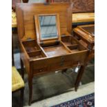 A 19th century French fruitwood enclosed dressing table,