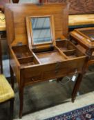 A 19th century French fruitwood enclosed dressing table,