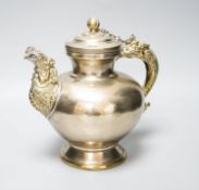 A late 19th/early 20th century Tibetan paktong, bronze and silver mounted teapot, 24cm