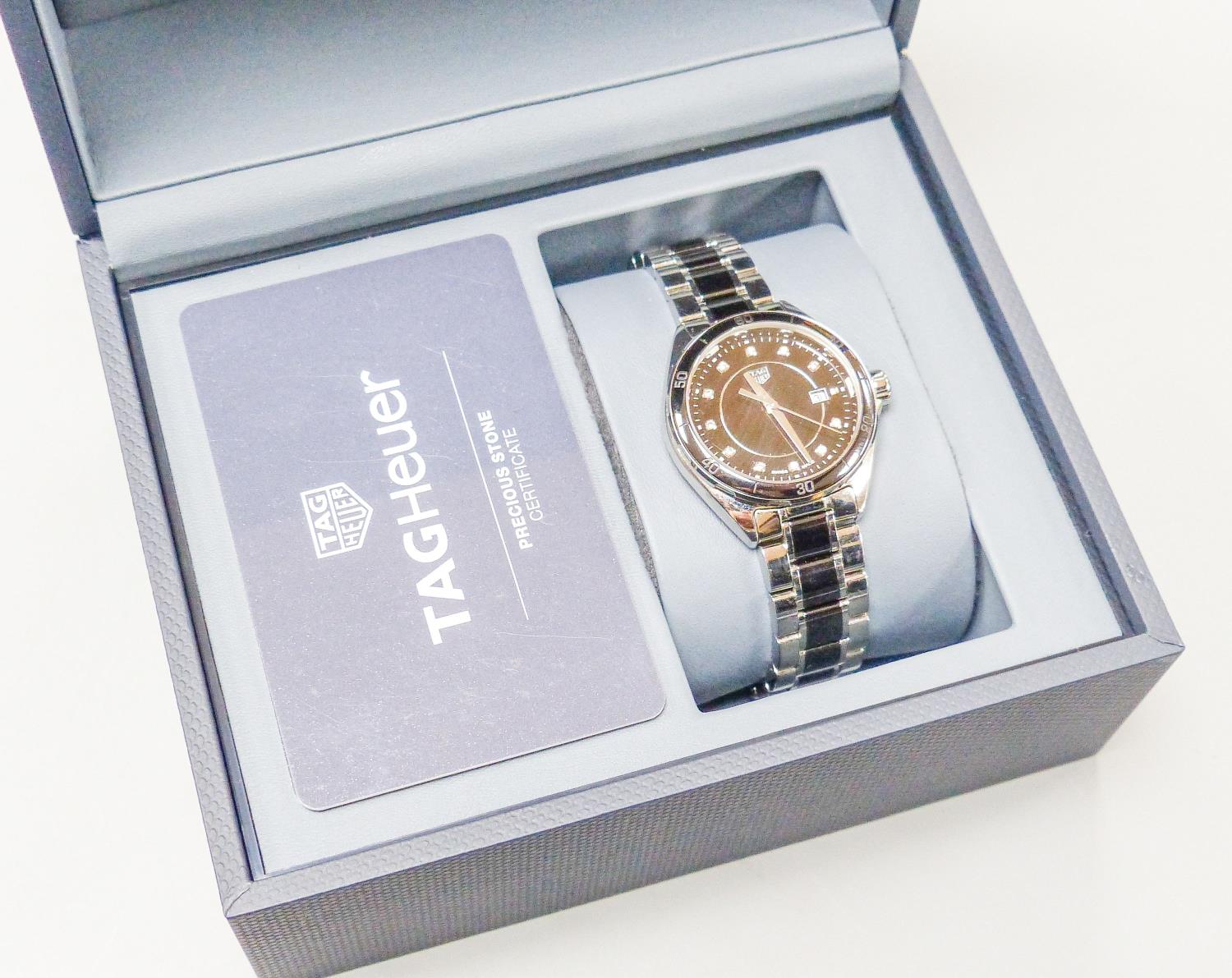 A modern stainless steel Tag Heuer quartz wrist watch with diamond dot numerals, case diameter 32mm,