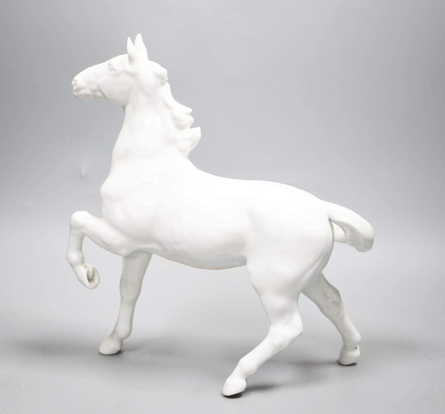 A Japanese porcelain figure of a horse, a Chinese blue and white dish, a Southeast Asian metal - Image 3 of 7