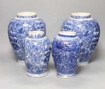 A pair of 18th century Dutch Delft blue and white oviform vases with floral decoration and two