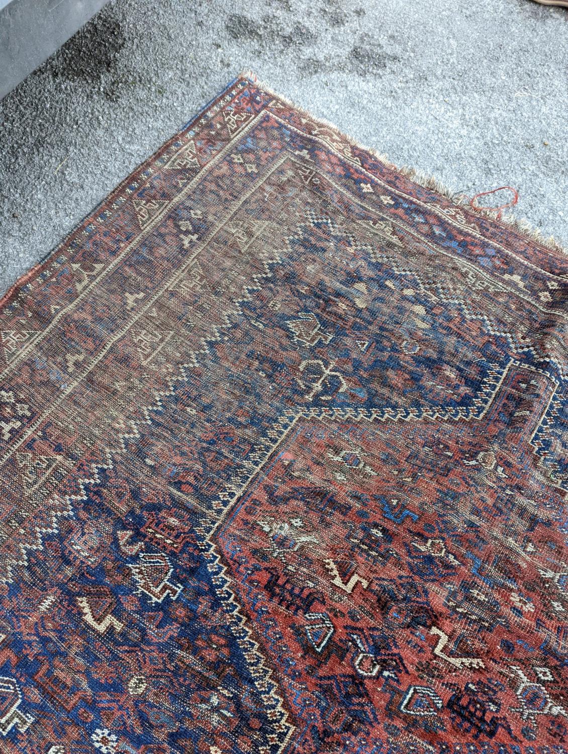 An antique Shirvan red ground carpet (worn), 295 x 207cm - Image 6 of 7