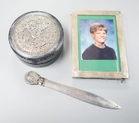 An Edwardian silver mounted photograph frame, 15.5cm, a letter opener with white metal finial and