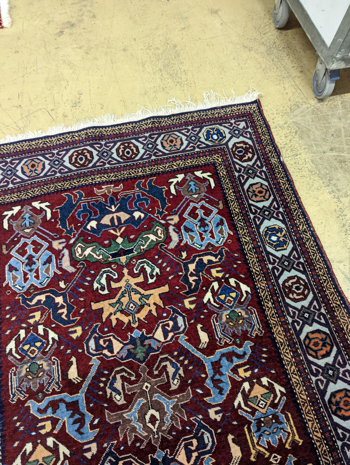 A Caucasian design burgundy ground rug, 153 x 100cm - Image 4 of 4