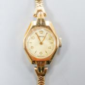 A lady's 9ct gold Vertex manual wind wristwatch on 9ct gold close flexible link bracelet, gross