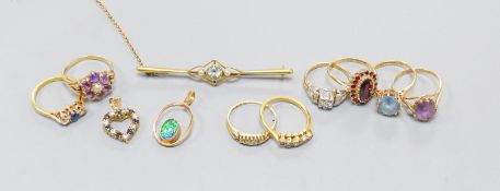 Three 18ct gold and gem set rings including two five stone half hoop(one stone missing) and a