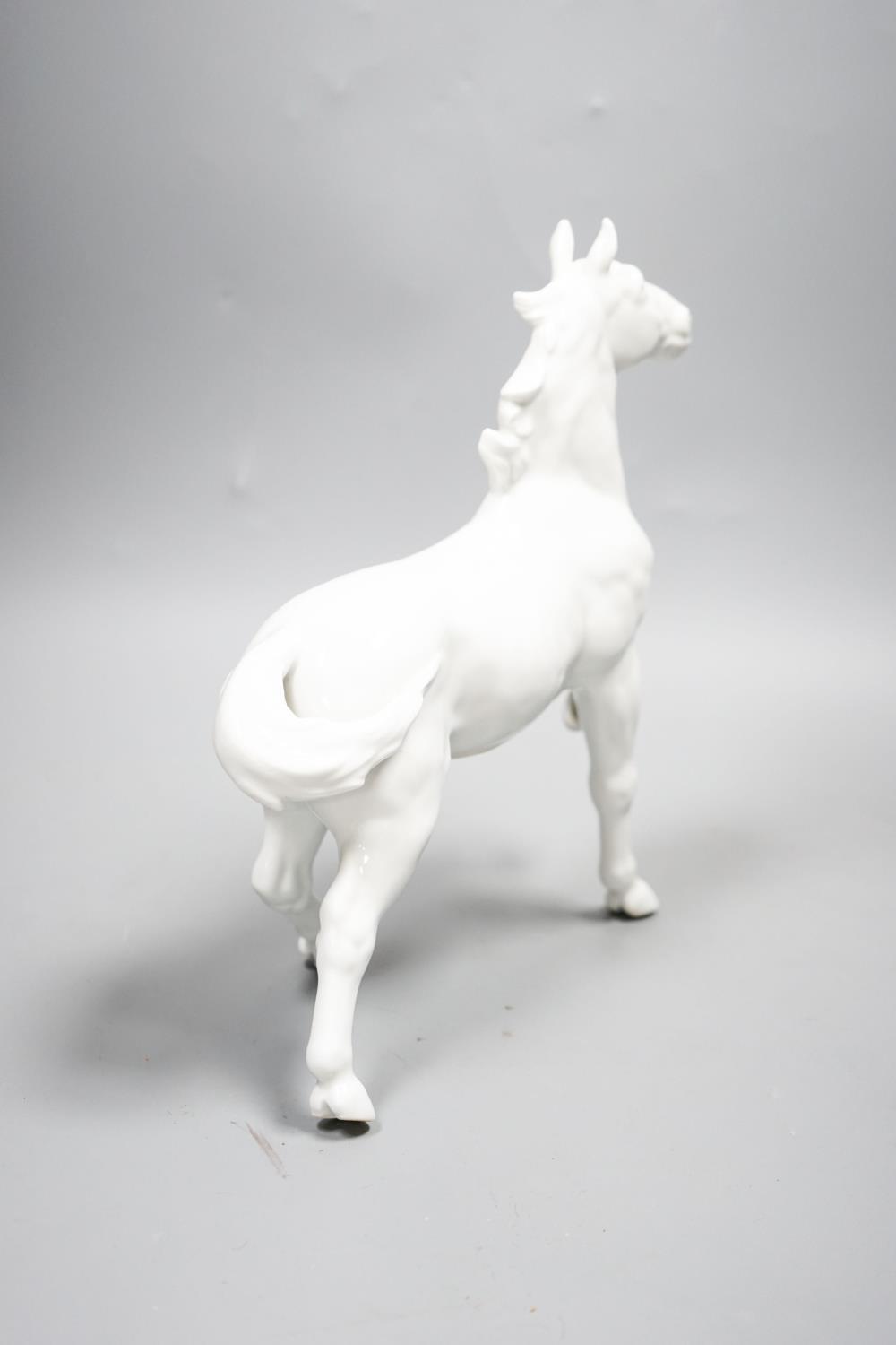 A Japanese porcelain figure of a horse, a Chinese blue and white dish, a Southeast Asian metal - Image 4 of 7