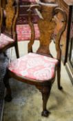 A set of four Queen Anne revival walnut dining chairs