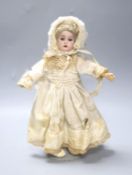 A Kammer & Reinhardt bisque doll, original clothes and shoes, 29cm