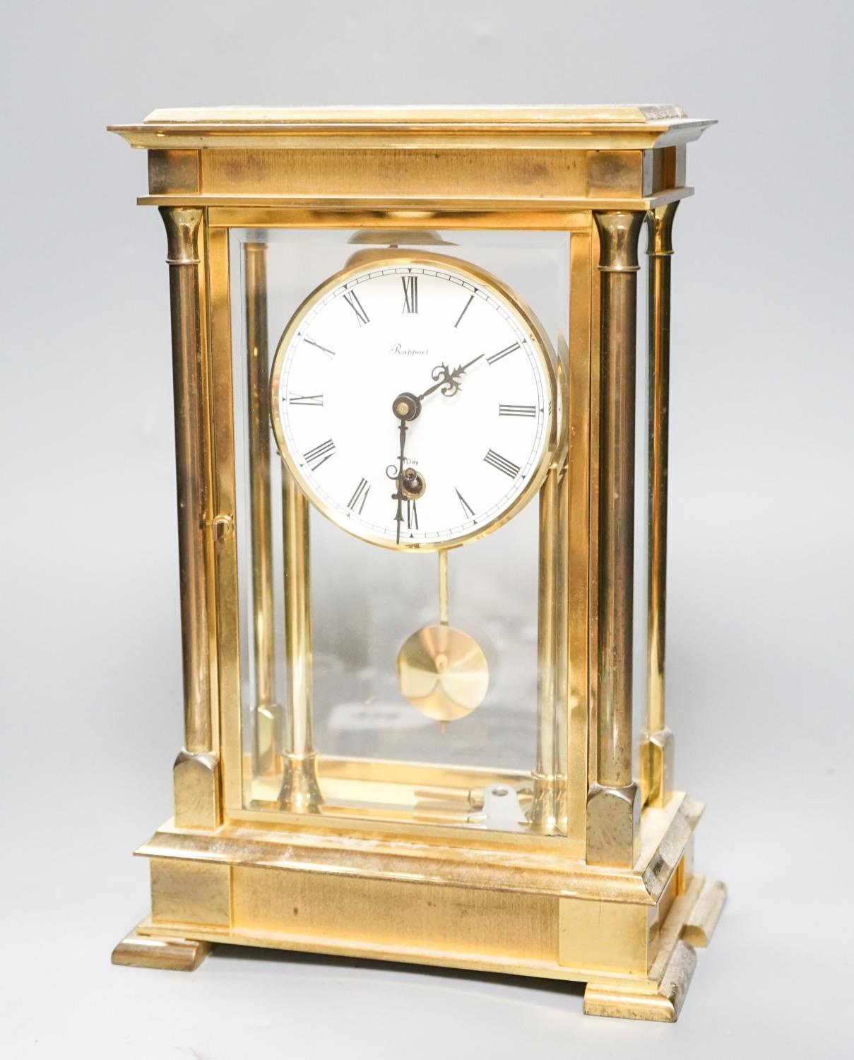An 8 day brass cased clock 29cm