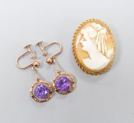 An oval cameo brooch in 9ct mount with rope-twist edge, 35mm and a pair of 9ct drop earrings set