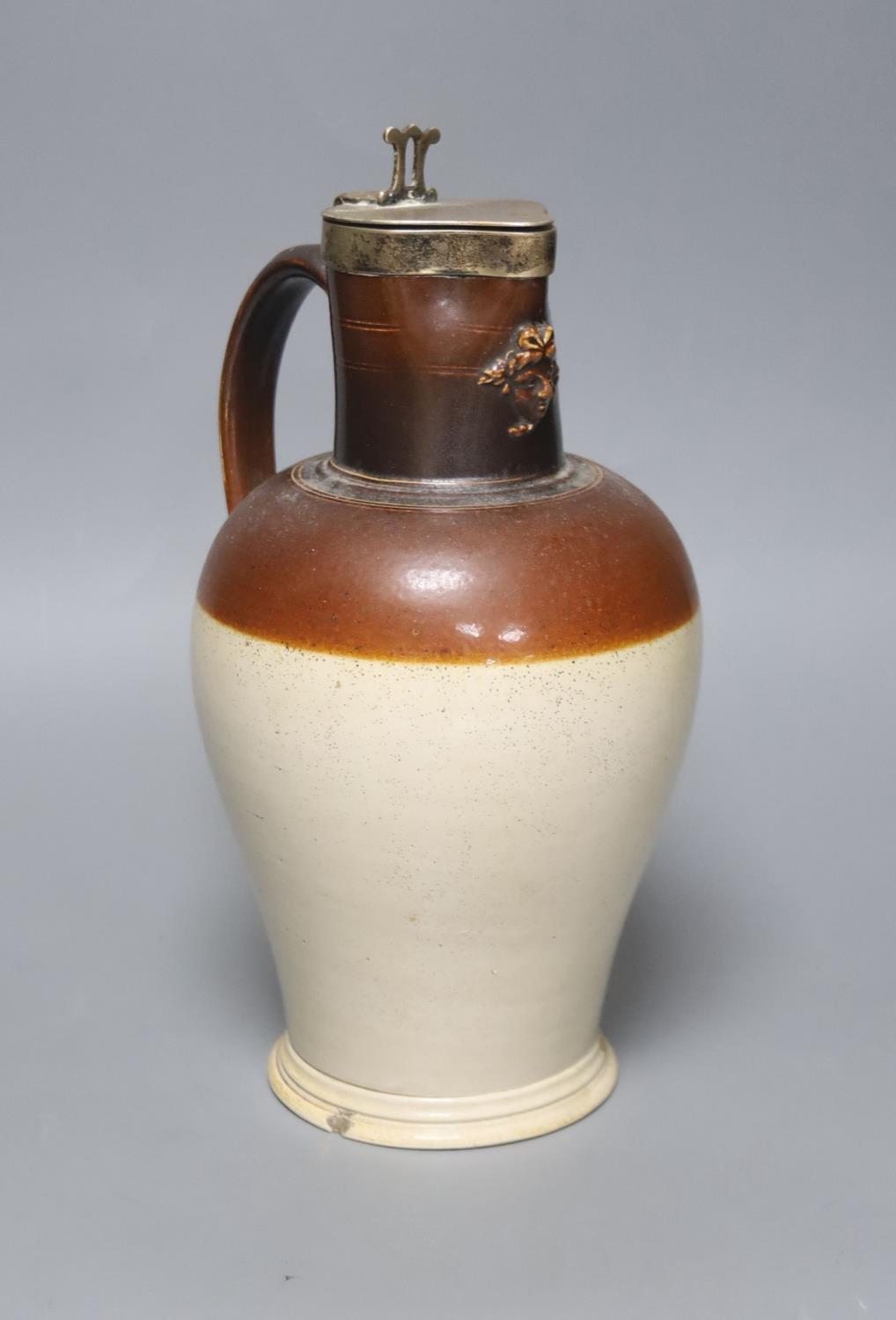 A silver mounted stoneware pitcher ‘presented by Joseph Neeld Esq to Joseph Cirvers 1848’ the base