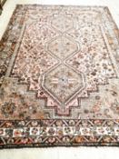A 20th century Shiraz rug, 300 x 210cm