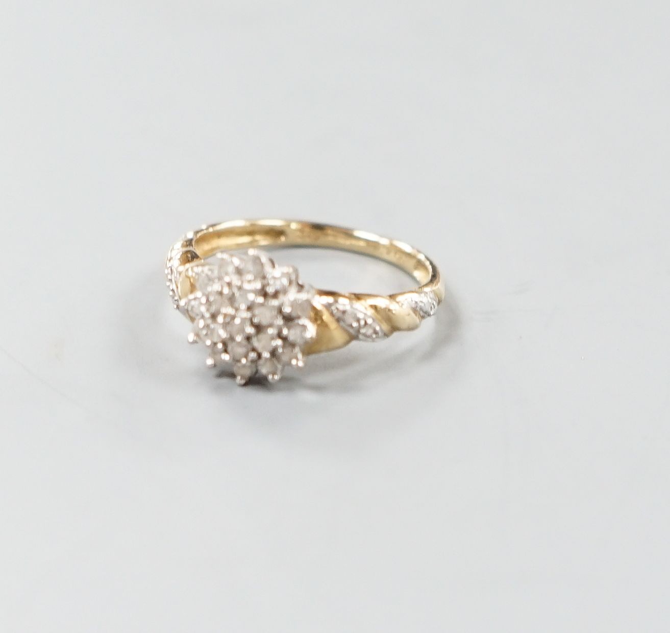 A modern 9ct gold and diamond cluster ring, with diamond chip set shoulders, size P, gross weight - Image 2 of 3