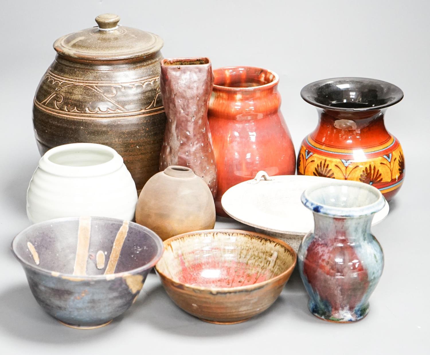 A group of studio pottery including a jar and cover, probably Norah Braden, 25 cm