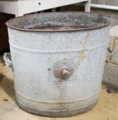 A galvanised metal tub, width 66cm height 60cm