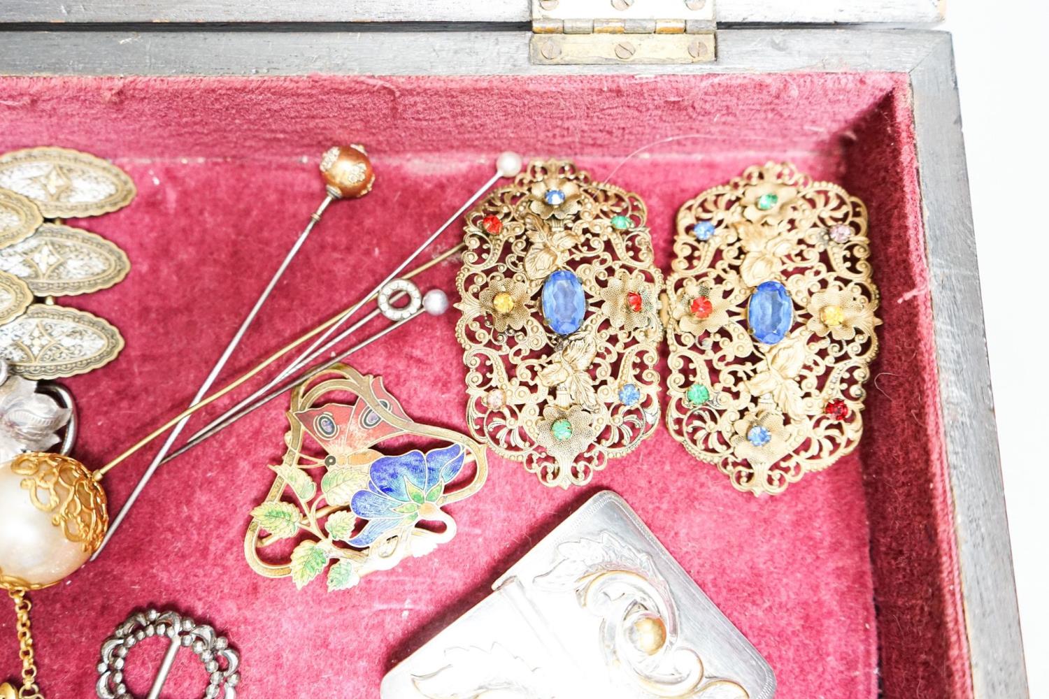 A group of belt buckles, clips and hatpins in a mahogany display case, 30.5cm - Image 4 of 4