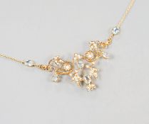 An Edwardian 9ct, aquamarine and seed pearl set drop pendant necklace, 40cm, gross weight 7.2