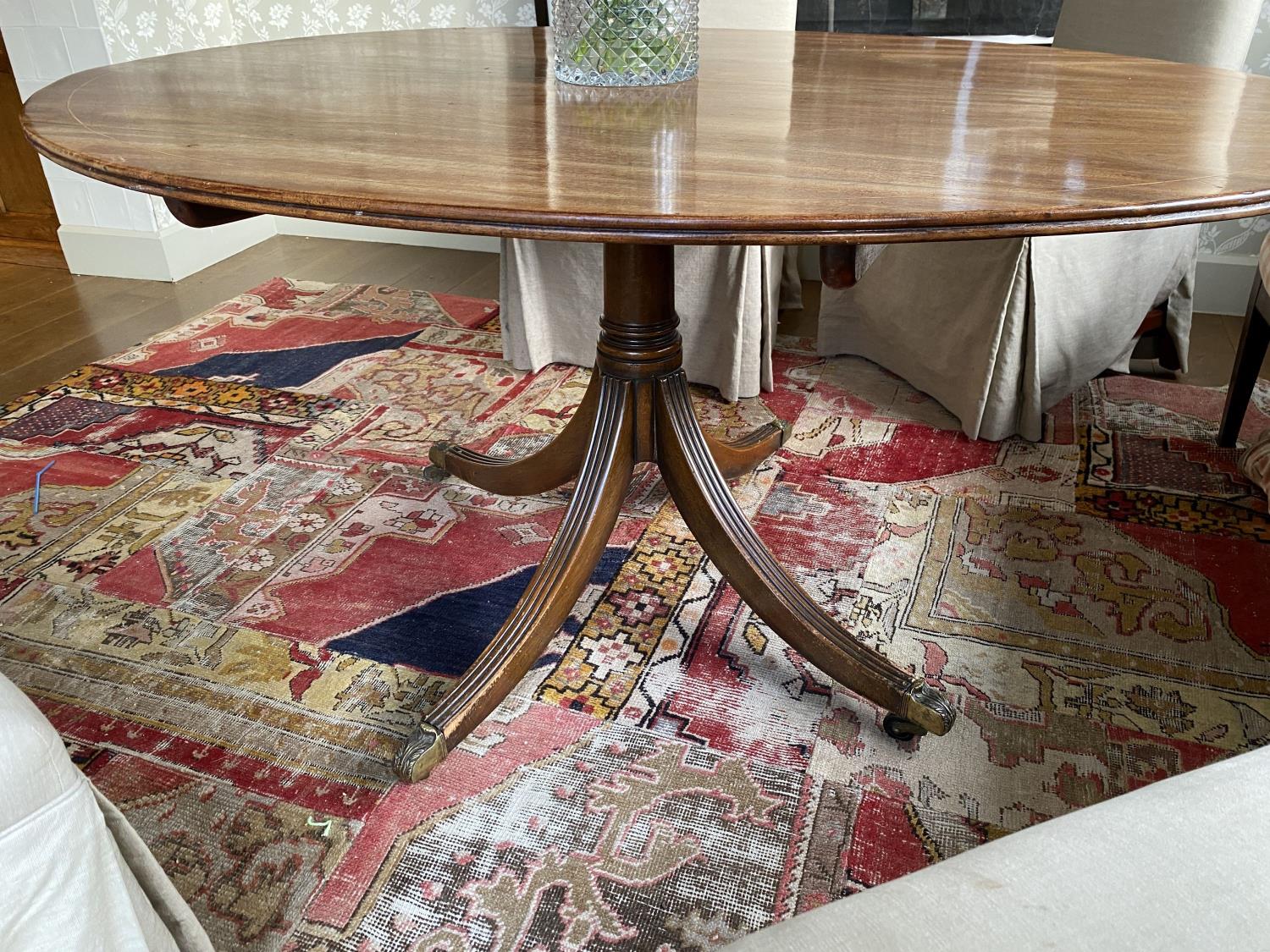 A Regency style mahogany breakfast table, with oval top on reeded downswept legs, width 150cm - Image 5 of 5