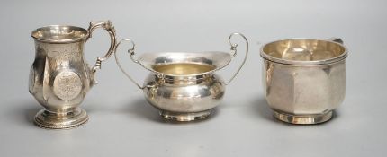 A Victorian silver christening mug, Birmingham, 1874, a later silver mug and a two handled sugar