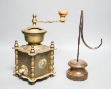 A 17th century rushlight nip and a later brass coffee grinder