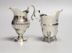 A late Victorian silver inverted pear shaped cream jug, Birmingham, 1894, 10.6cm, and a later silver