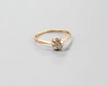 A George V 18ct gold and claw set solitaire diamond ring, size N/O, gross 1.6 grams.
