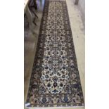 A Kashan ivory ground runner, 396 x 90cm